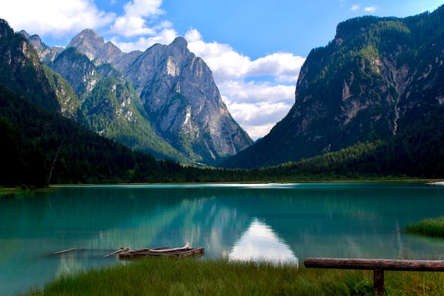 Dobbiaco, Trentino-Alto Adige, Italy :Majestic mountain landscape with Lake Toblach, surrounded by lush forests in Dobbiaco, Italy.