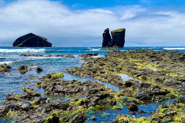 Rugged volcanic coastline of Mosteiros, Azores showcasing stunning rock formations in the Atlantic Ocean.